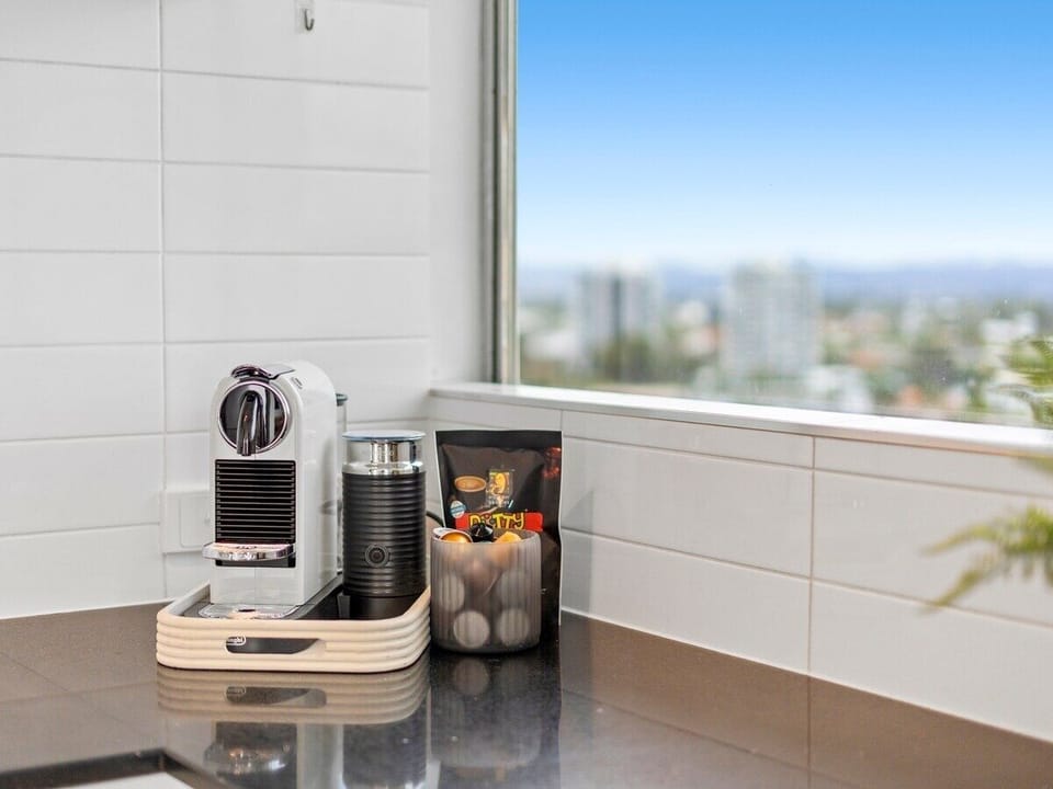 Kitchen with full-size appliances, Nespresso coffee, cookware and dining basics.