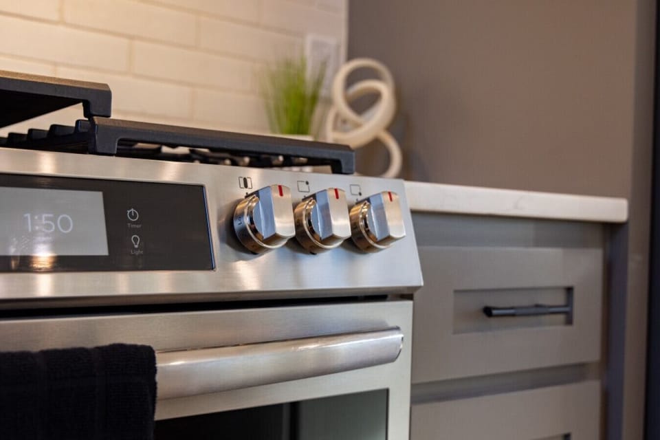Professional-grade kitchen features a modern gas stove and oven, providing everything needed for home-cooked meals.