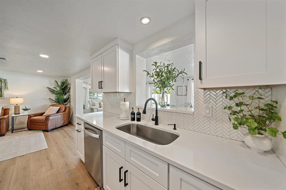 Enjoy the beautiful views of the sunroom from the kitchen sink!
