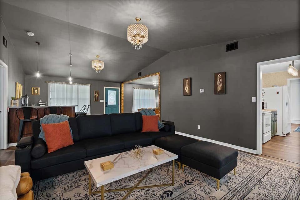 Spacious living room w/ sectional sofa, TV & relaxed lounge vibe