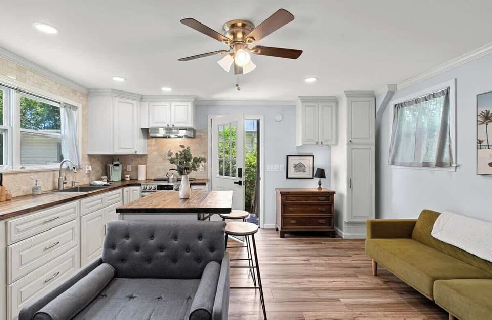 Fully equipped kitchen w/ island seating, stainless appliances & open layout