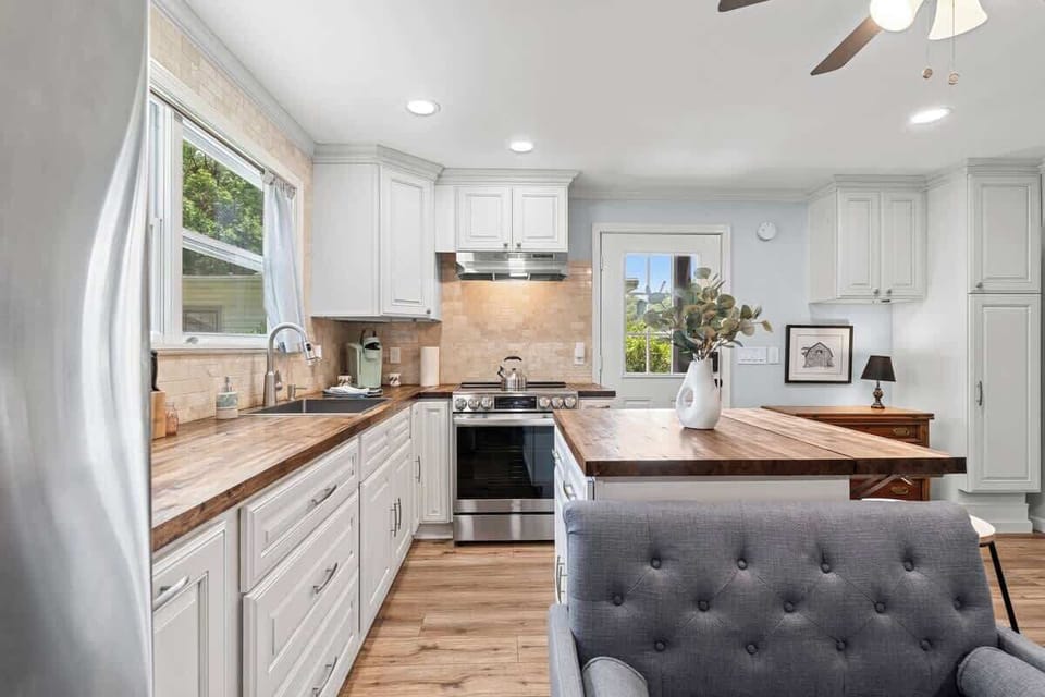 Kitchen w/ ample counter space, window views & modern appliances for easy cooking