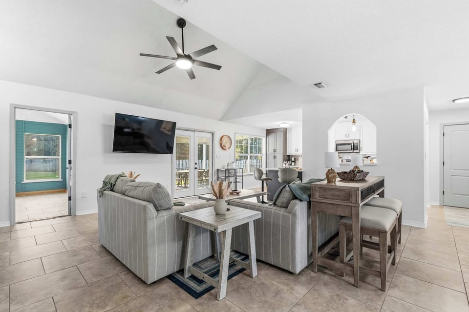 Spacious open living & dining area w/ multiple seating spots & natural light