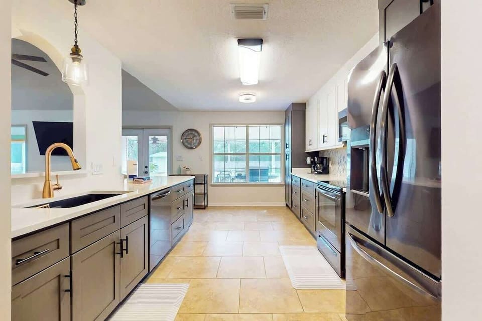 Fully equipped kitchen w/ ample counter space, modern finishes & bright lighting