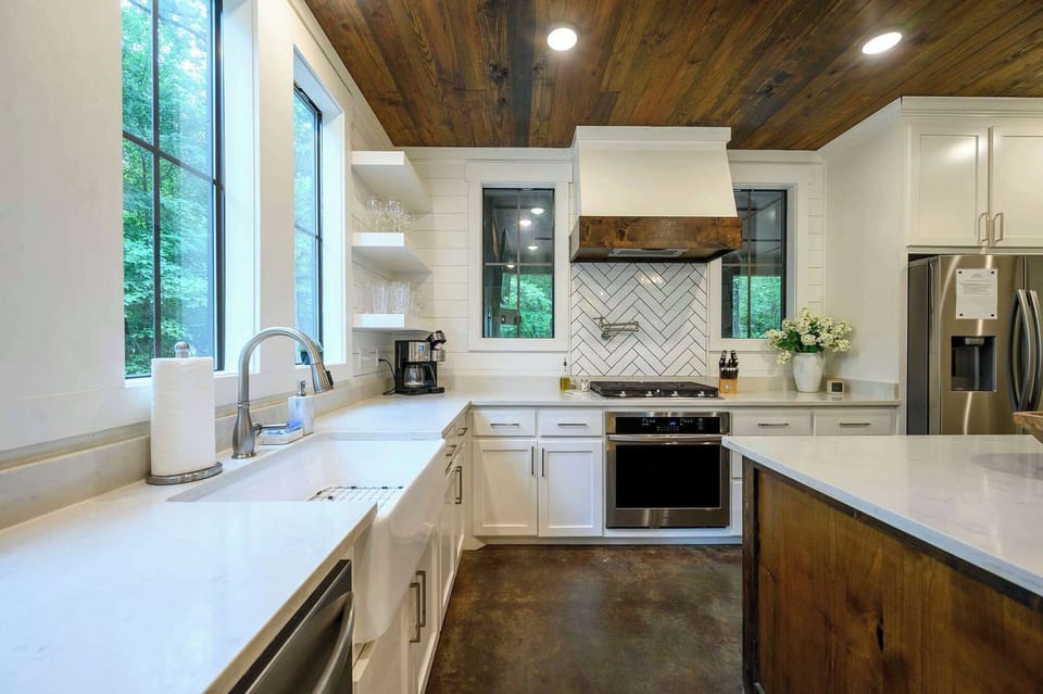  Stocked, styled & ready — everything from the herringbone backsplash to the stainless appliances says this kitchen means business.