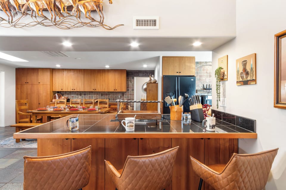 Dining room with bar seating for three.