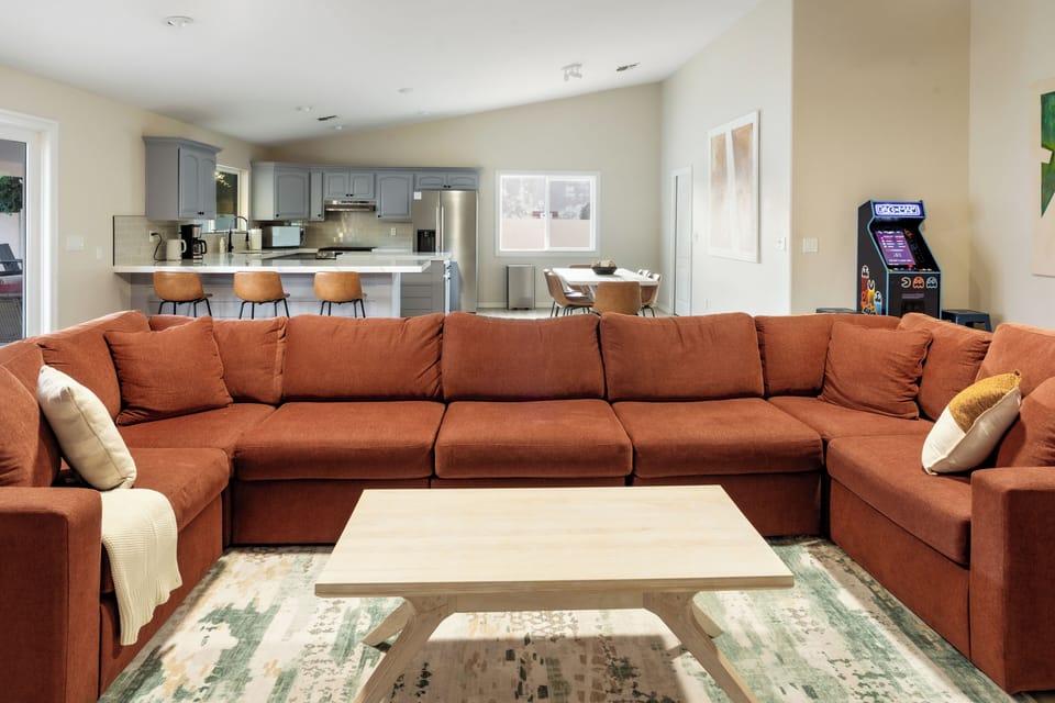 Open-concept living, chef's kitchen, and full arcade — all in one space
