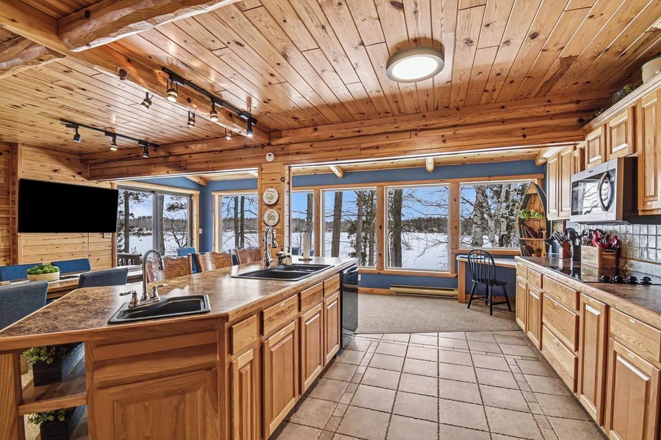 Kitchen with panoramic windows overlooking the lake.