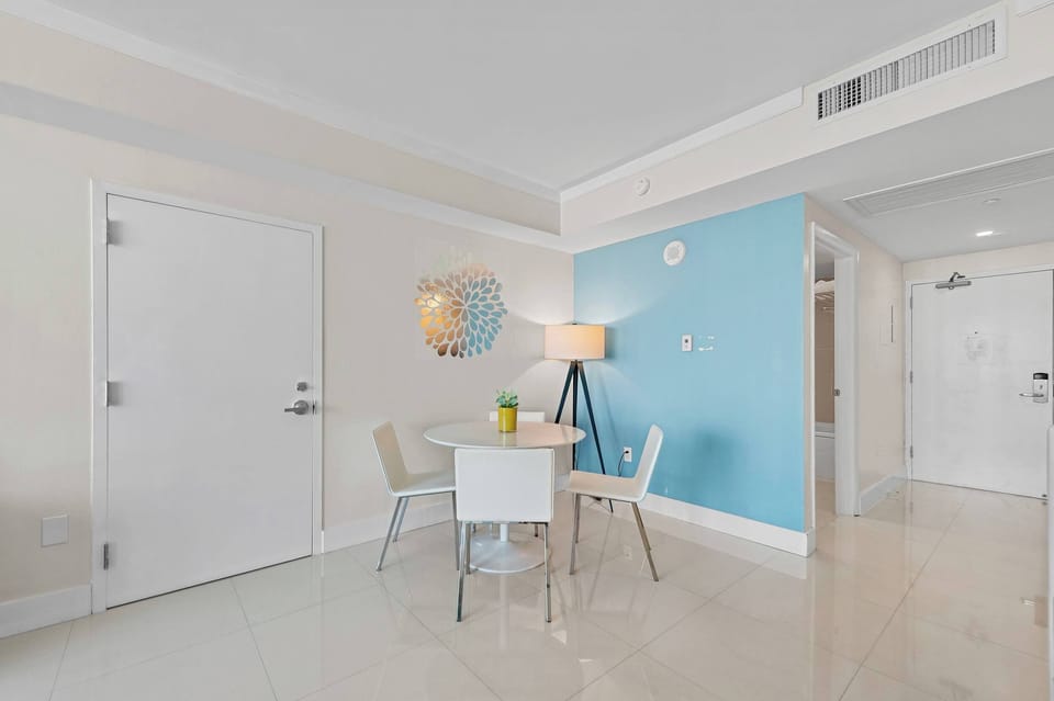 Small dining space with blue accent wall