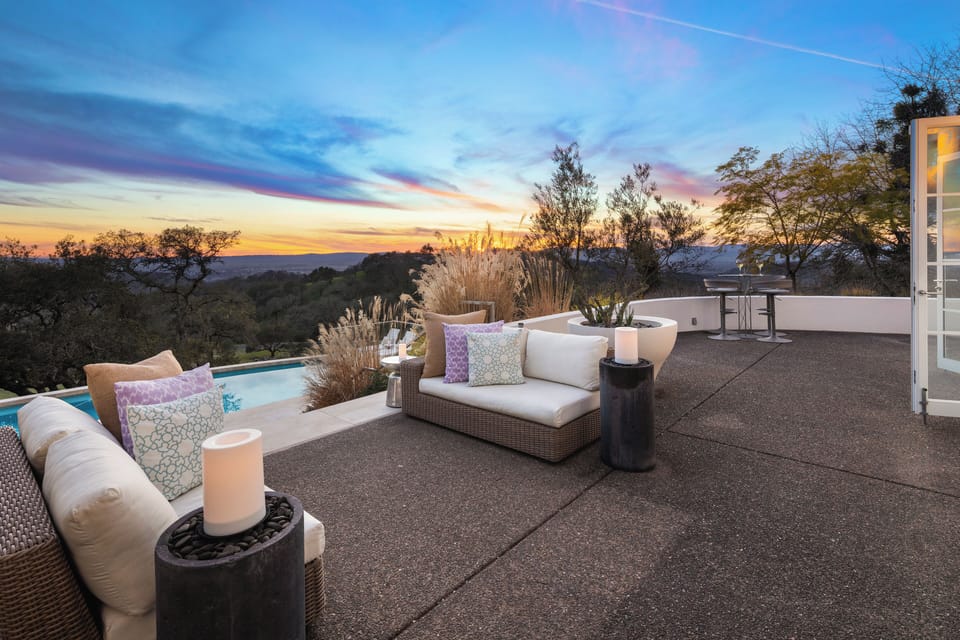 Uncovered patio with outdoor living and stunning mountain view.