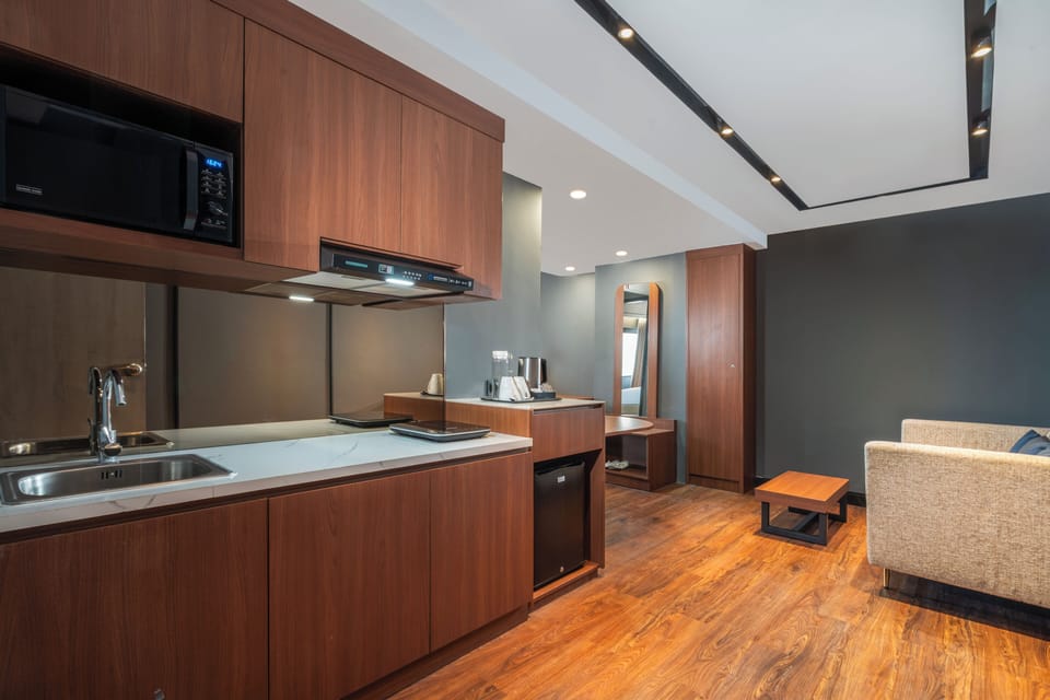 Family Room, Multiple Beds | Private kitchenette | Microwave, electric kettle