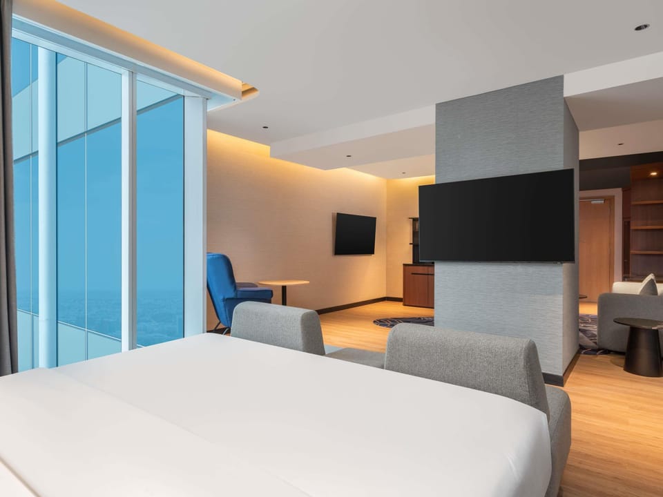 Family Suite, 1 King Bed with Sofa bed, Pool View | Premium bedding, in-room safe, laptop workspace, blackout drapes