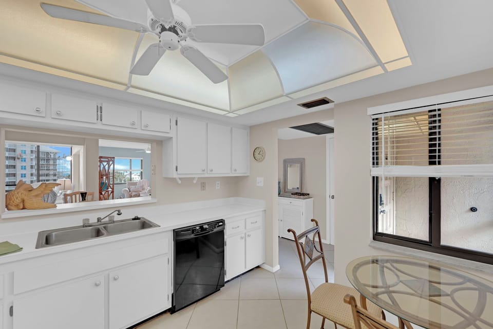 Windows allow for natural light to flood the kitchen in your beachfront condo
