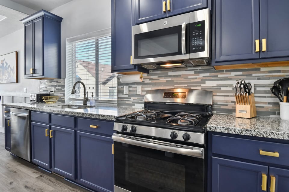 A fully equipped chefs kitchen features new stainless steel appliances, a massive island, Gas oven/range, dishwasher, microwave, toaster, Coffee Service and many other amenities.
