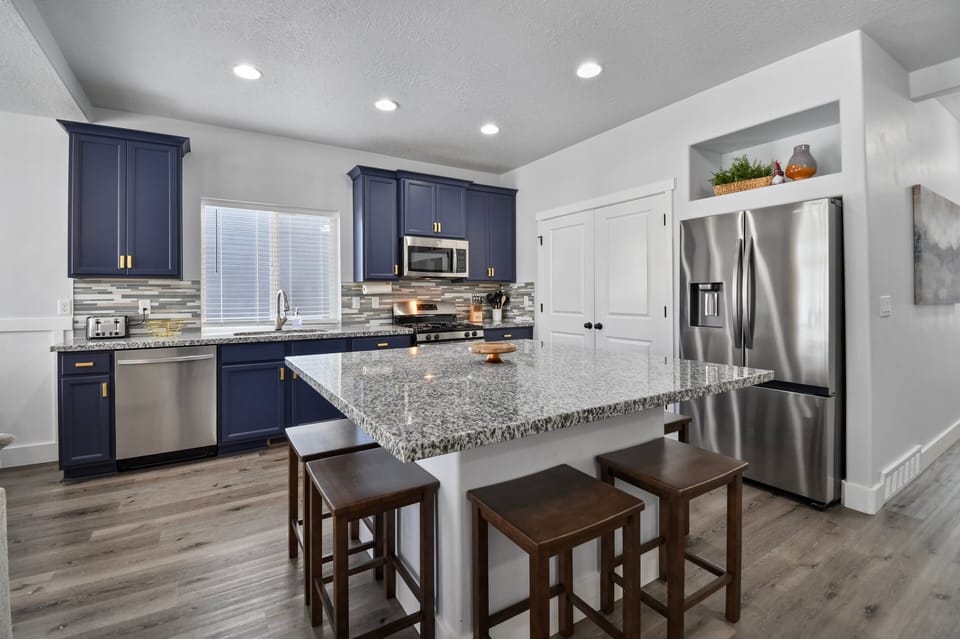 A fully equipped chefs kitchen features new stainless steel appliances, a massive island, Gas oven/range, dishwasher, microwave, toaster, Coffee Service and many other amenities.