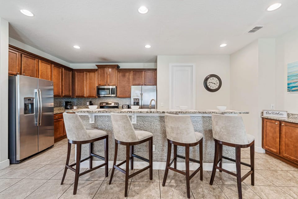 Pull up a stool at the large kitchen island perfect for casual meals & conversation