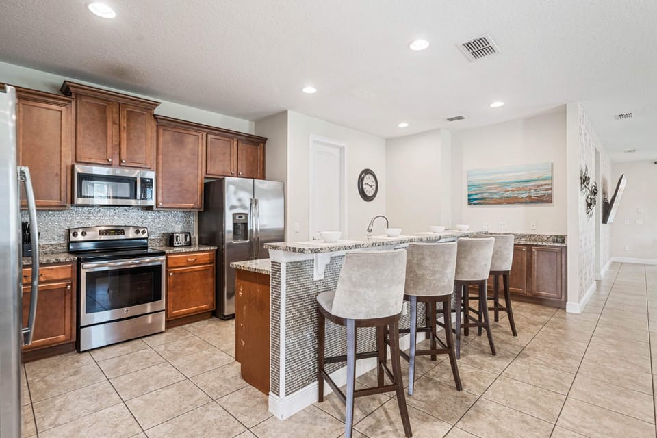 Cook with ease in the fully equipped kitchen w/ ample counter space & modern appliances