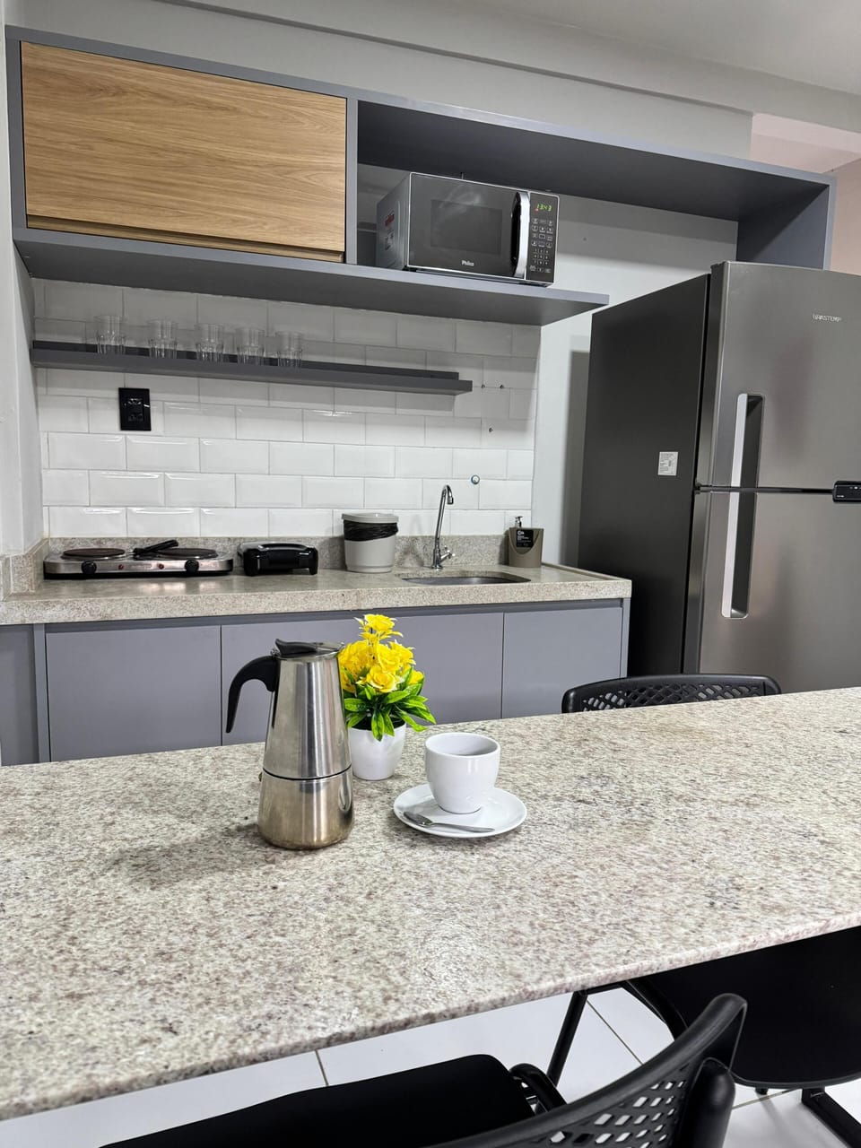 Full-size fridge, microwave, toaster, cookware/dishes/utensils