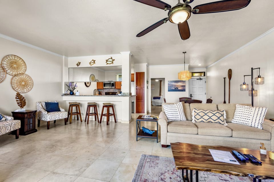 Imagine yourself relaxing in this airy, open-concept space featuring coastal-chic décor, a fully equipped kitchen, and comfortable seating—your perfect home away from home.