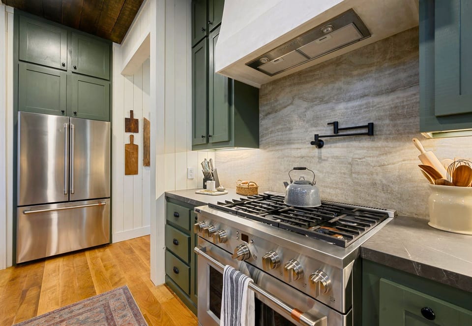 Modern stainless steel appliances and beautiful cabinetry make this kitchen as functional as it is stylish.