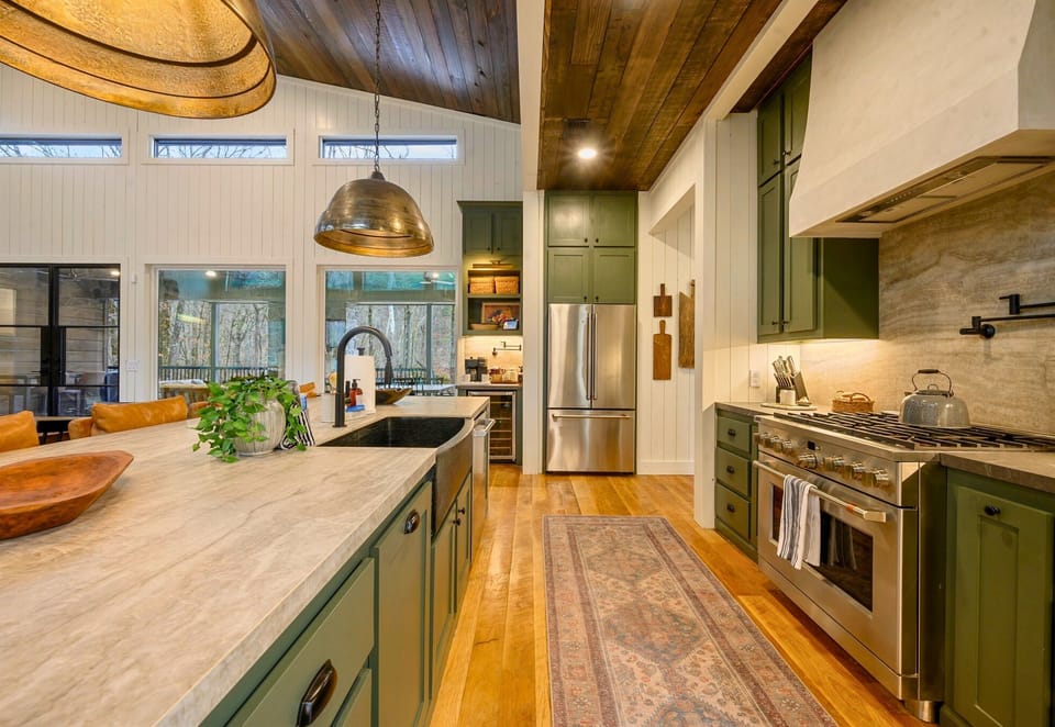 Another angle gives you a peek at the spacious counters and warm finishes that make cooking feel effortless here.