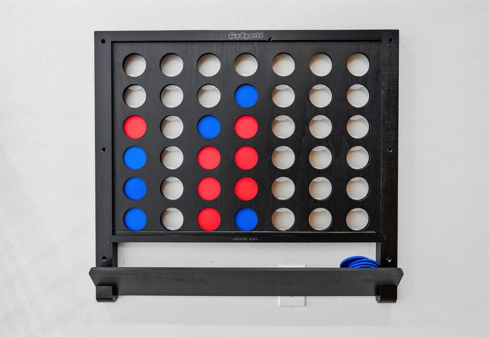 A game setup in the loft adds a fun, casual element that guests of all ages can enjoy.