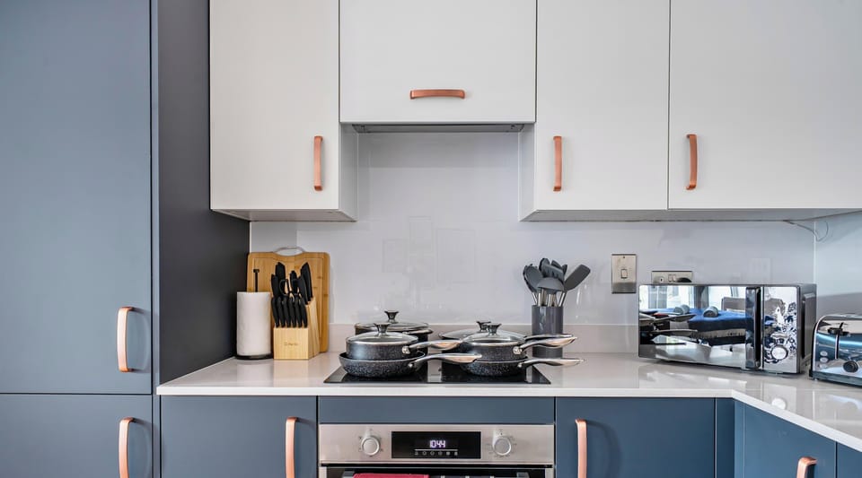 Modern kitchen with dishwasher and full appliances