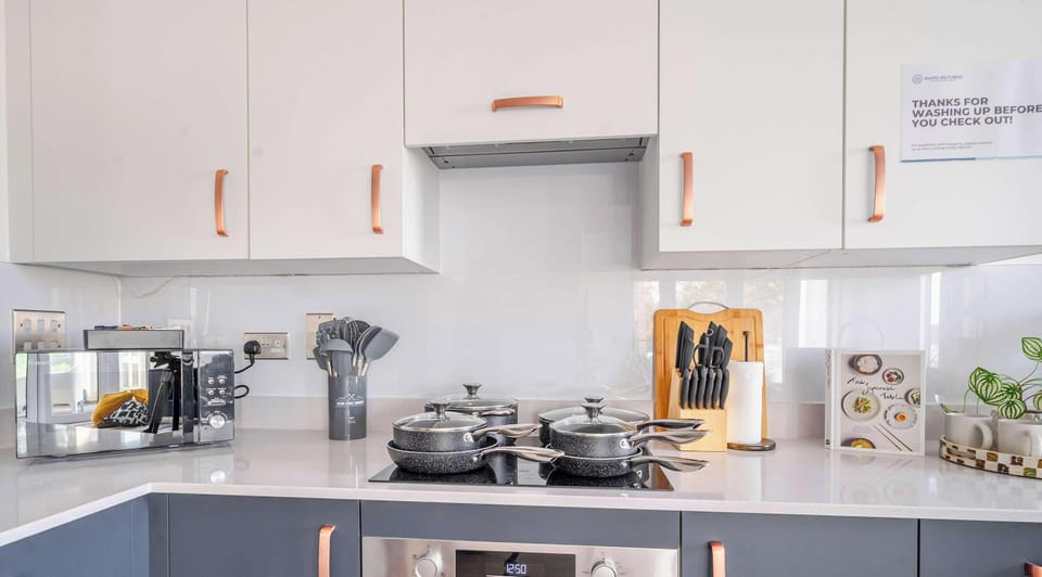 Modern kitchen with dishwasher and full appliances