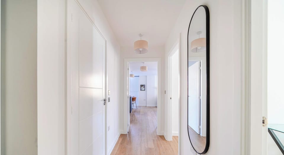 Bright entrance hallway with full-length mirror