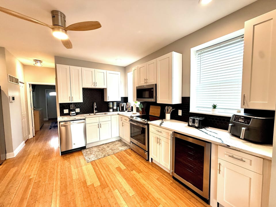 All major appliances including Kuerig, Airfryer, baking items, and a wine fridge