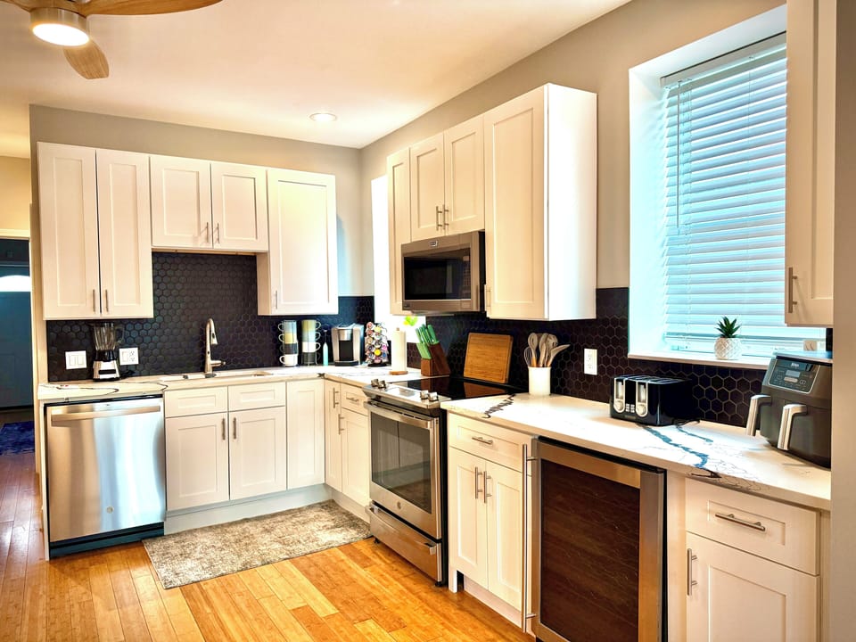 All major appliances including Kuerig, Airfryer, baking items, and a wine fridge