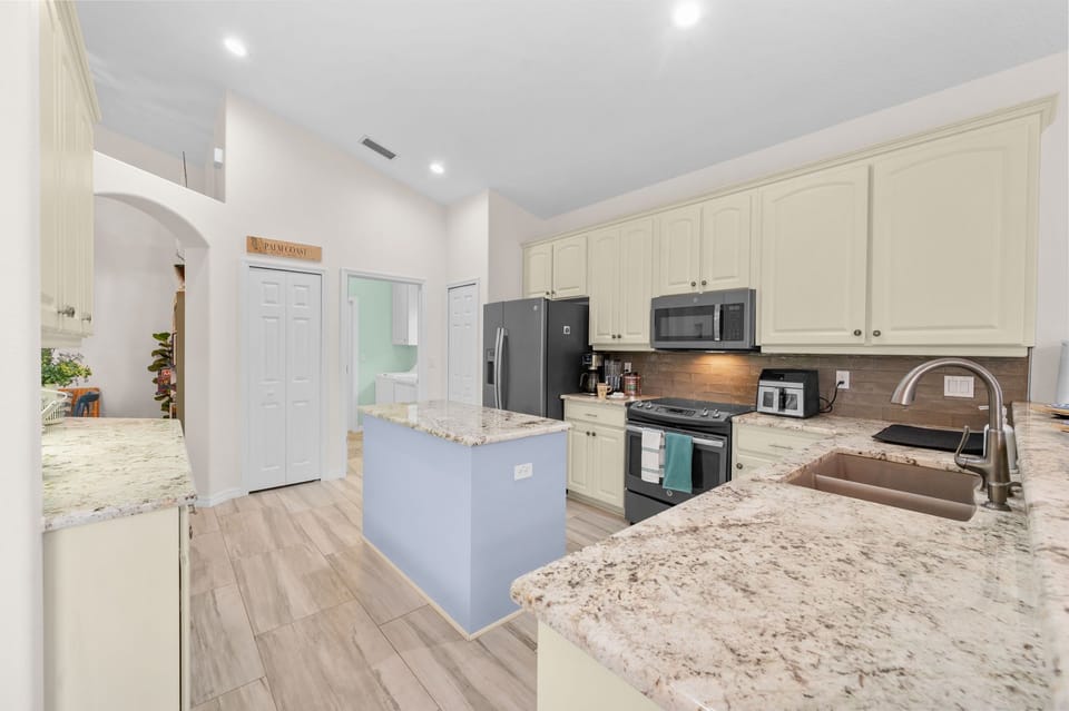 A welcoming kitchen space designed for easy meal prep and relaxed gatherings.