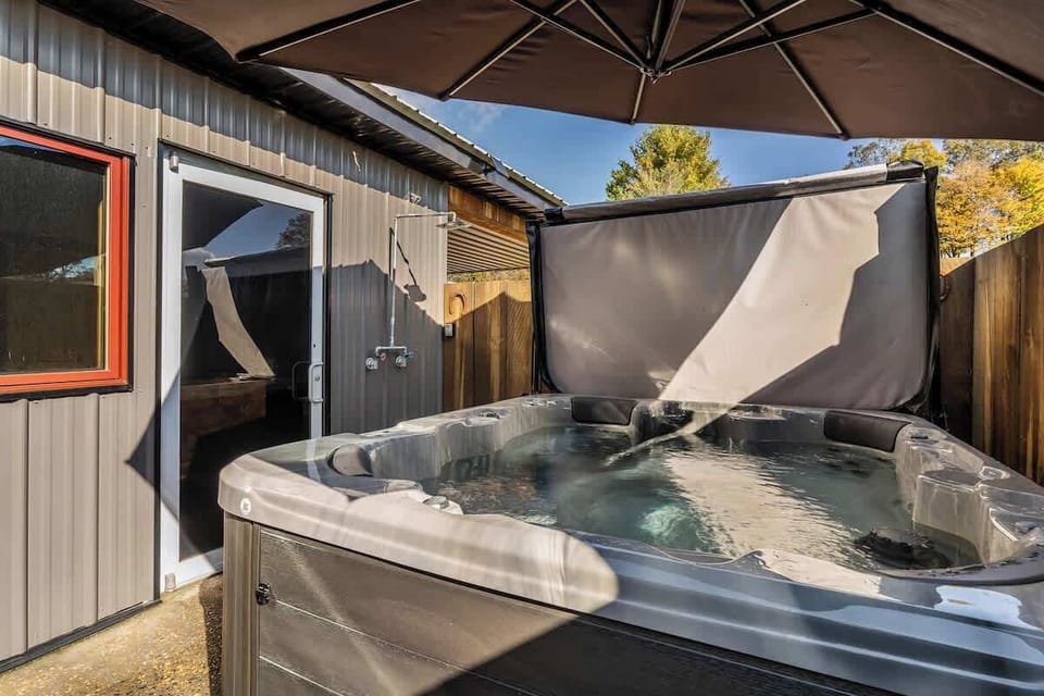 Unwind and soak in the relaxing hot tub, perfect for a peaceful evening after a day of exploring.