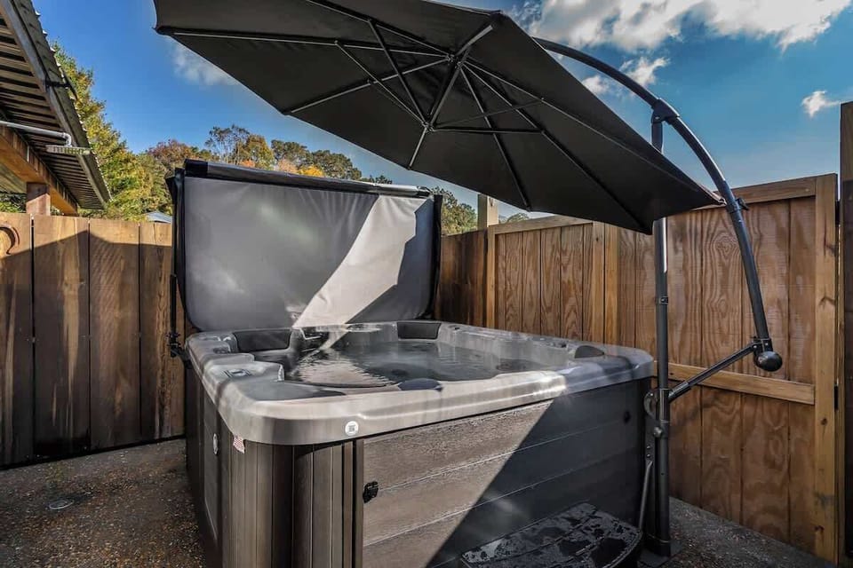 Unwind and soak in the relaxing hot tub, perfect for a peaceful evening after a day of exploring.
