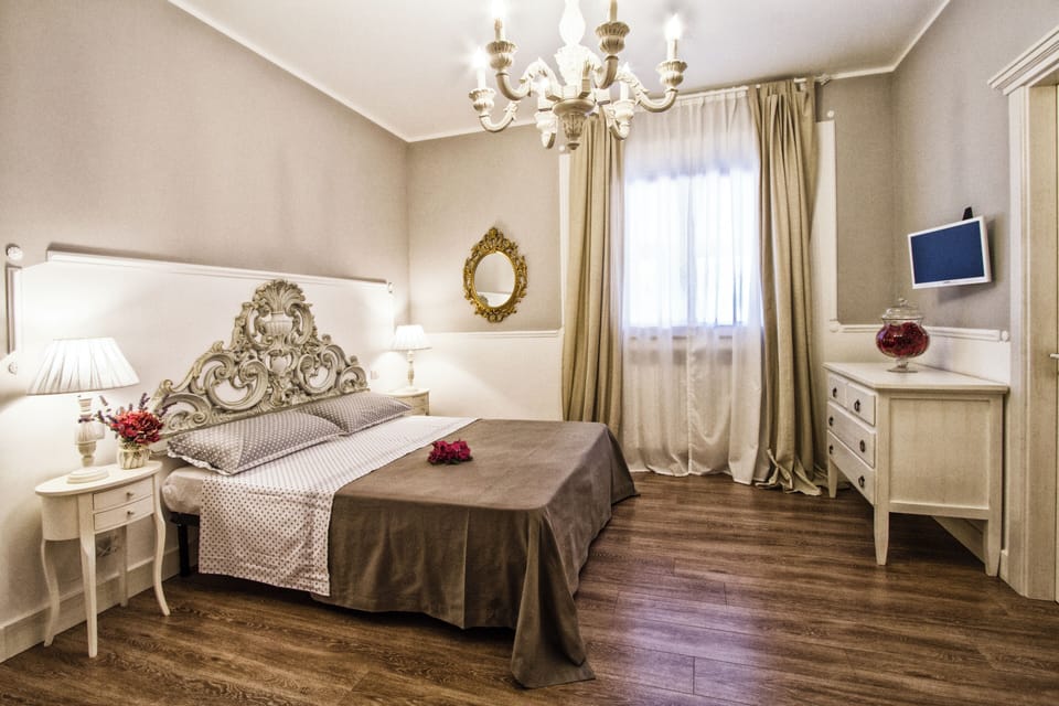 Luxury Triple Room, Pool View | Blackout drapes, iron/ironing board, free WiFi