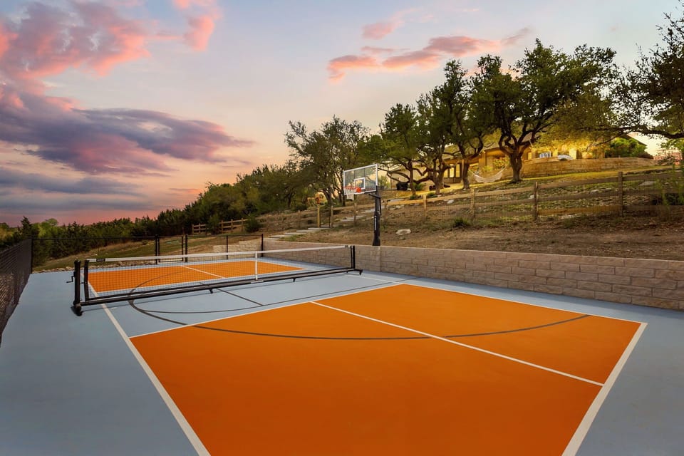 Private pickleball and sports court in the backyard.