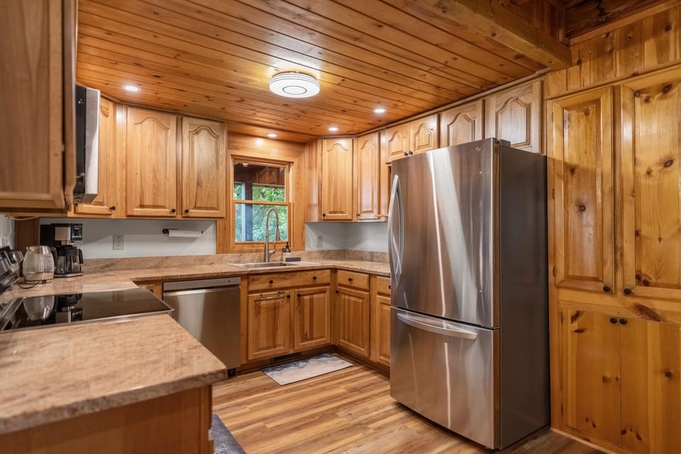 Fully stocked kitchen with modern stainless steel appliances