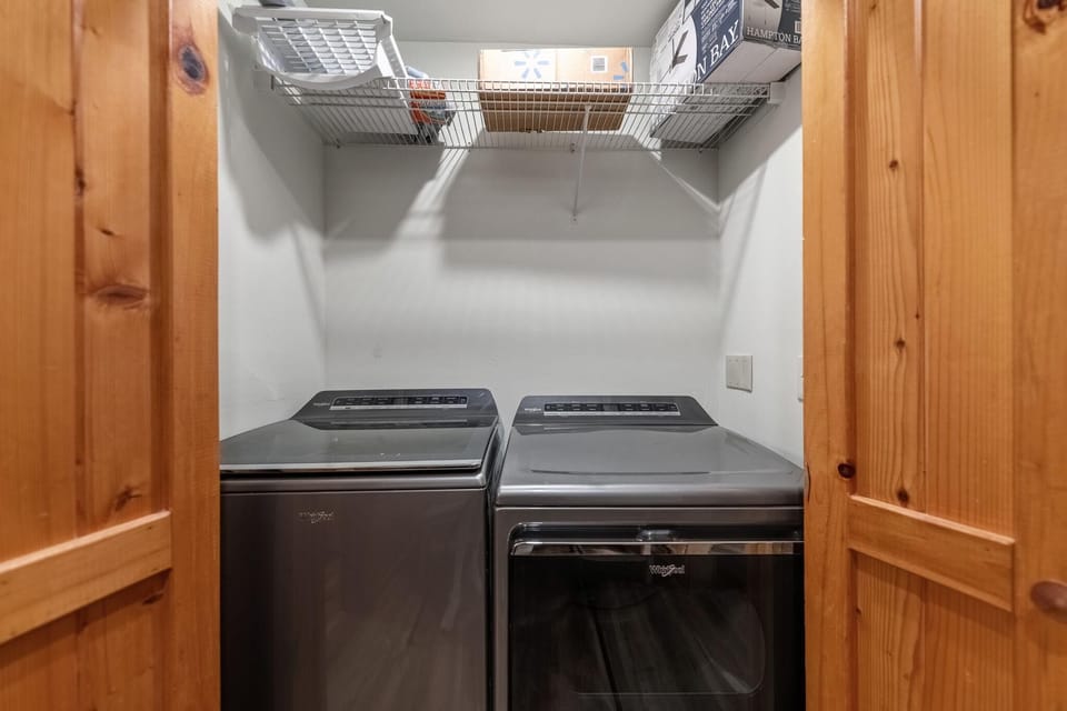 Cozy laundry room with modern washer and dryer setup