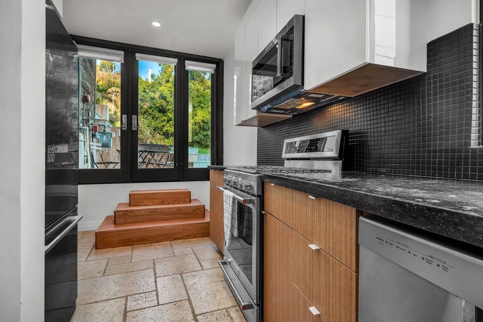 Full kitchen equipped with stove, oven, refrigerator and dishwasher. Private and separate Guest Entrance.
