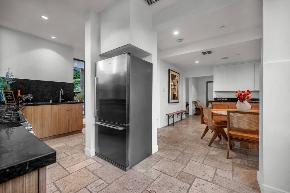 Central kitchen hub connecting to dining.