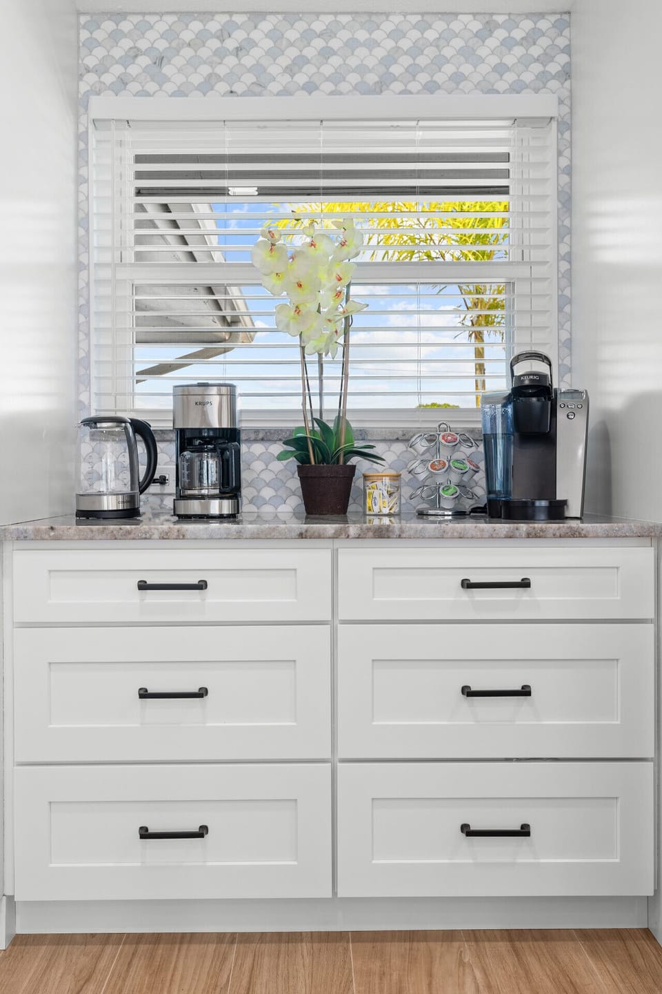 Fully stocked coffee and tea bar with drip, Keurig, and electric kettle options — enjoy your perfect morning brew.