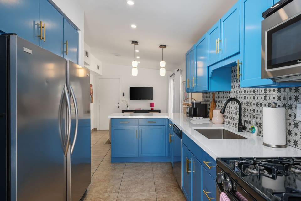 Sleek and stylish kitchen stocked with essentials. Perfect for relaxed meals during your Palm Springs getaway.