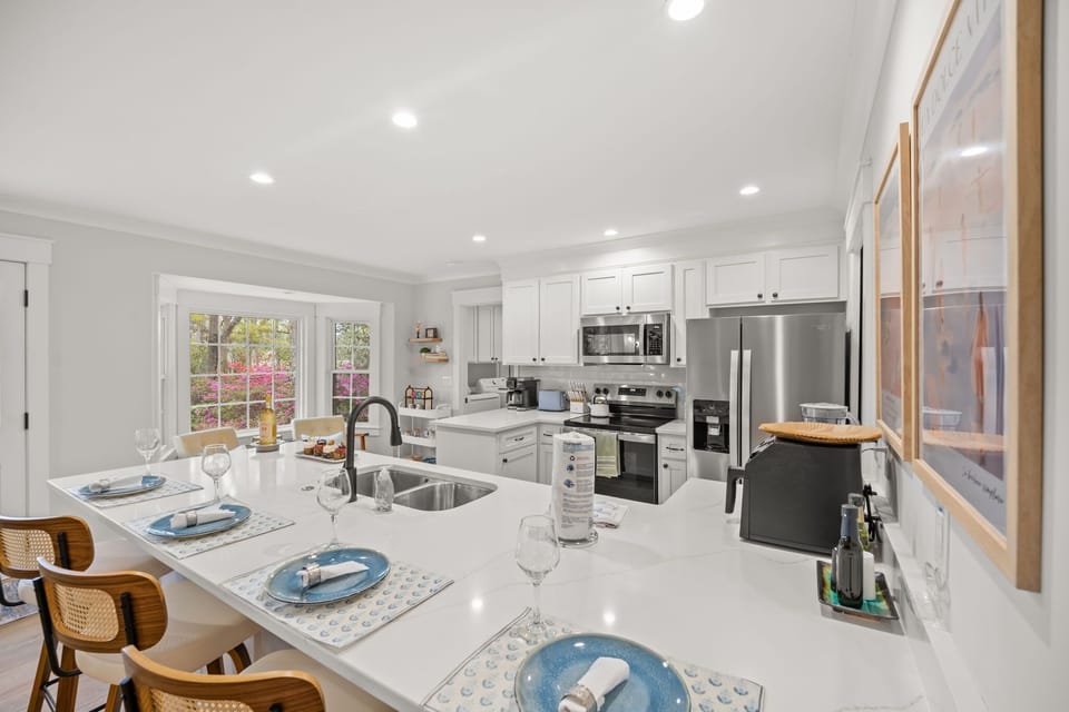 Spacious Kitchen with Barstool Seating, an Air Fryer, Blender, and Cooking Oils