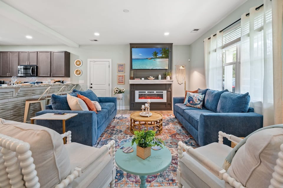 Cozy Living Room Seating with an Electric Fireplace, Smart TV & lots of Seating!