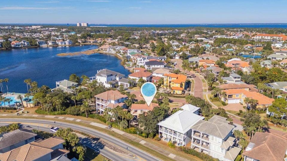 Aerial view of the home set among lush surroundings