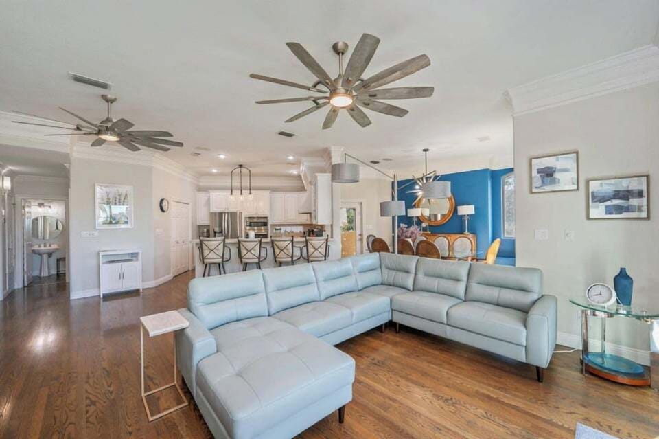 Spacious open-concept living area w/ plush seating that flows easily into the kitchen & dining space
