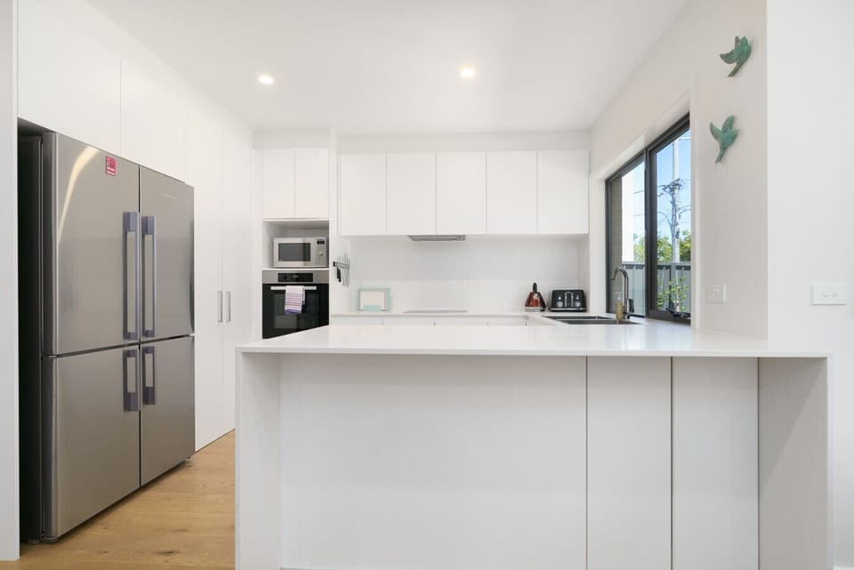 Prep, cook, or sip your morning coffee at this sleek kitchen island.