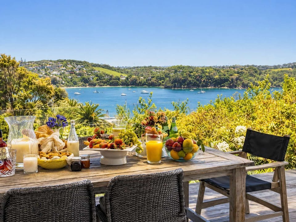 Balcony with outdoor dining overlooking Little Oneroa and Oneroa beach