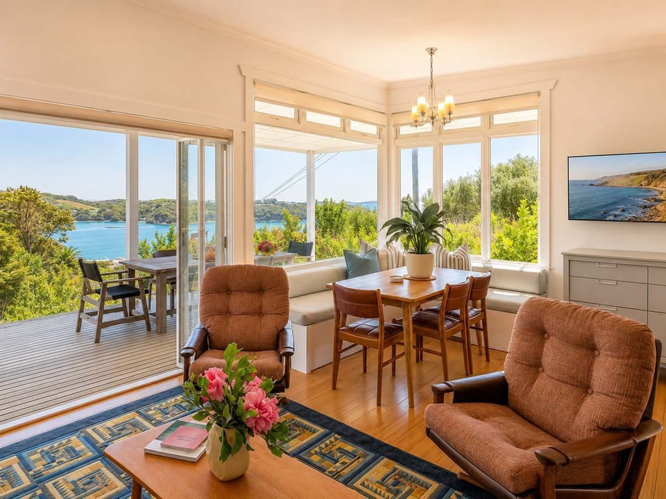 Open plan living, dining and kitchen with views over Little Oneroa beach 