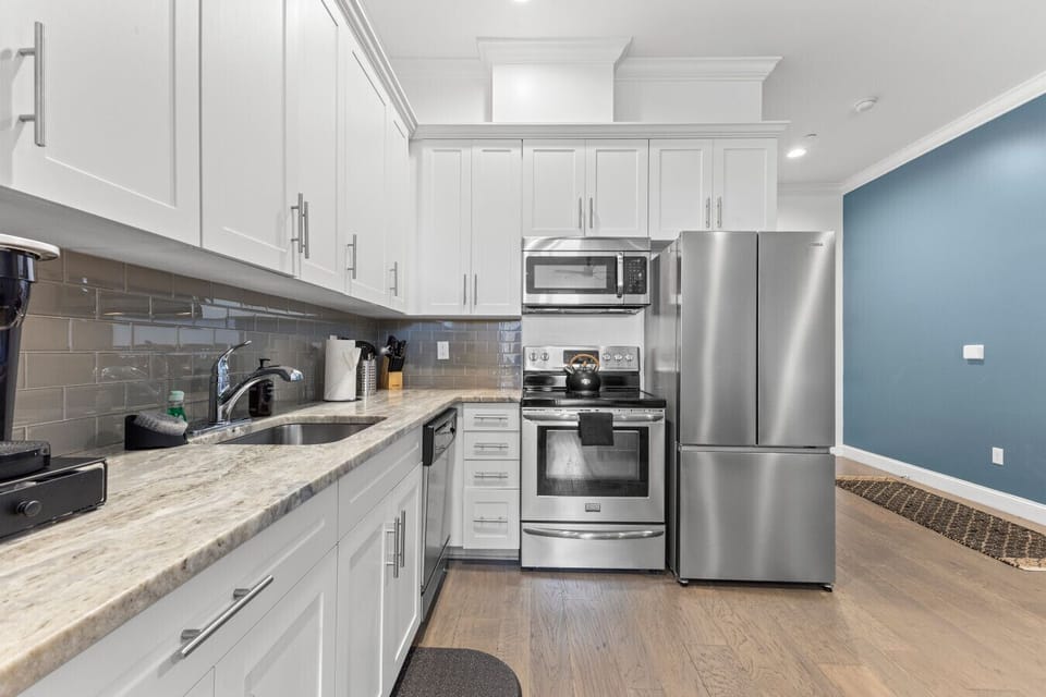 Full kitchen includes fridge, freezer, dishwasher, stove, oven, microwave, Keurig coffee maker and all the cookware and silverware you`ll need to whip up a home cooked meal